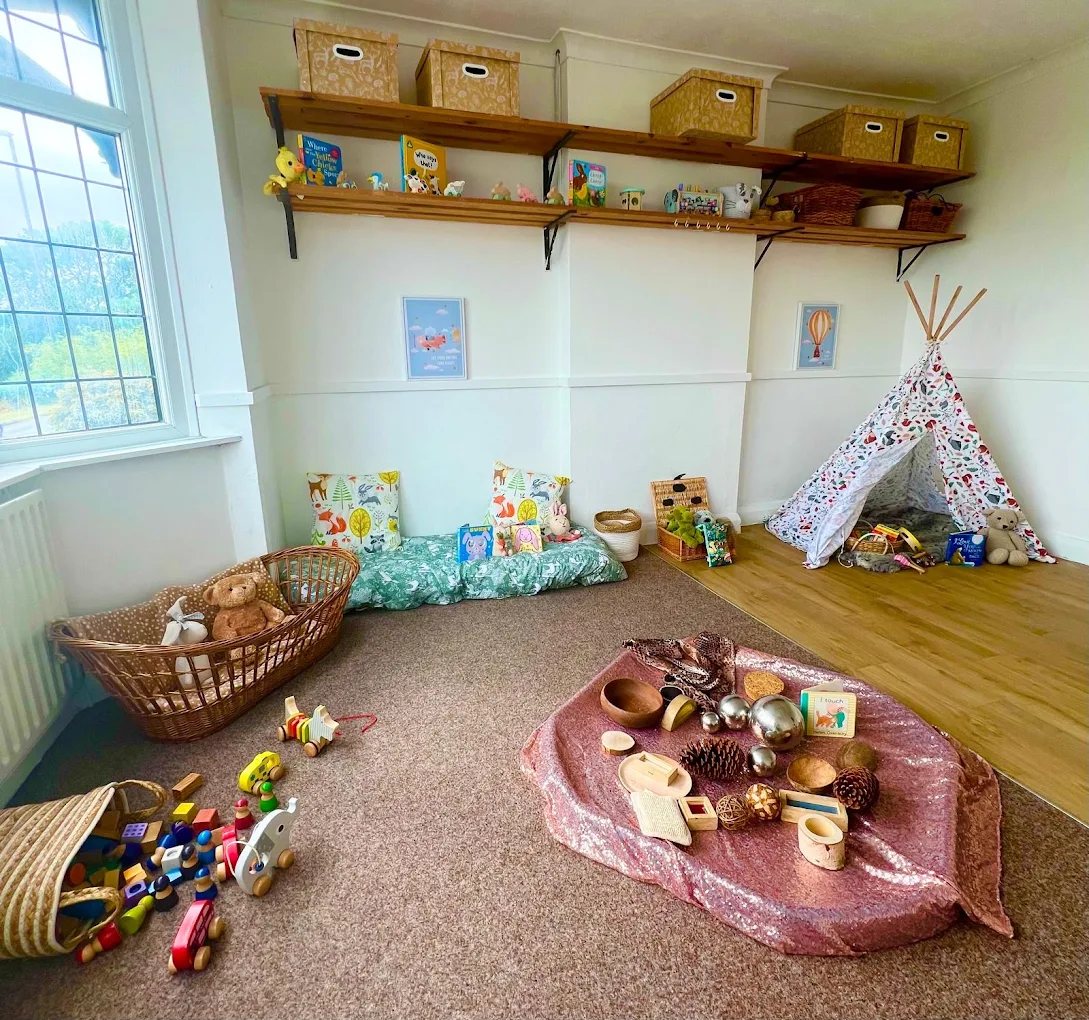 Playroom at The Lanes with a reading corner and treasure basket