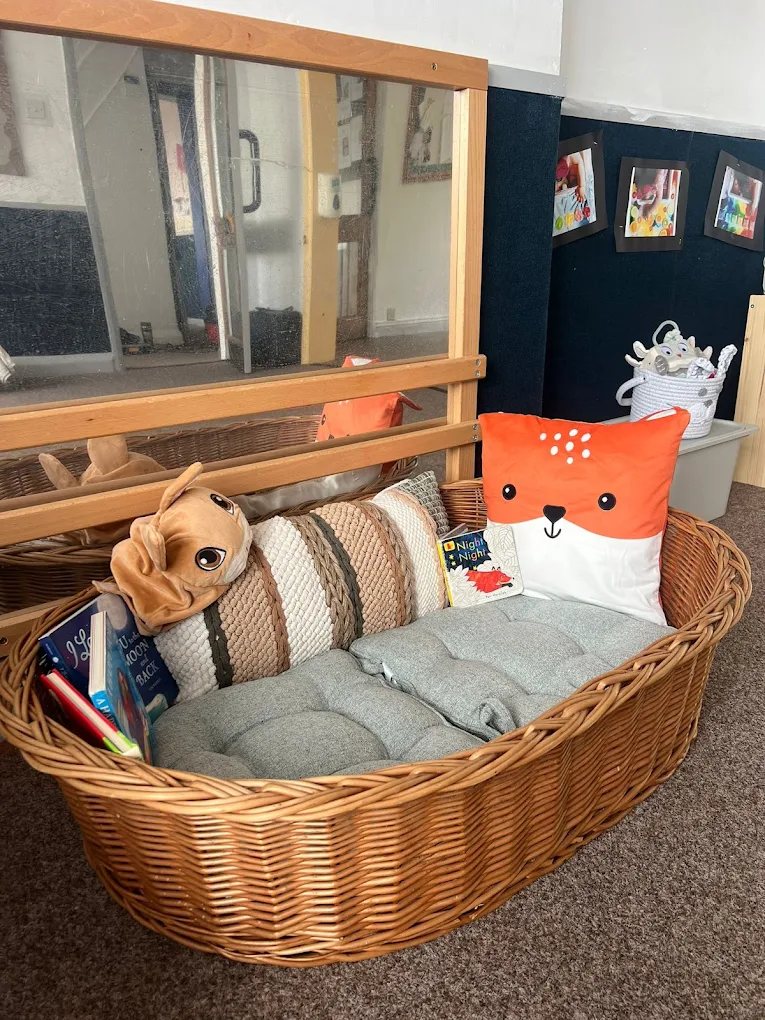 Cosy reading basket with cushions and picture books